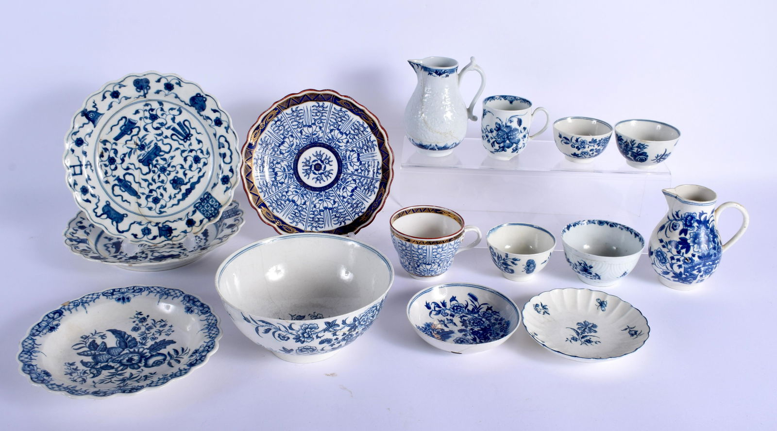 Worcester study collection: two sparrowbeak jugs, a: Worcester study collection: two sparrowbeak jugs, a workman’s mark coffee cup, a Royal Lilly cup with script Flight mark, four tea bowls and a slop bowl, two saucers, four plates.