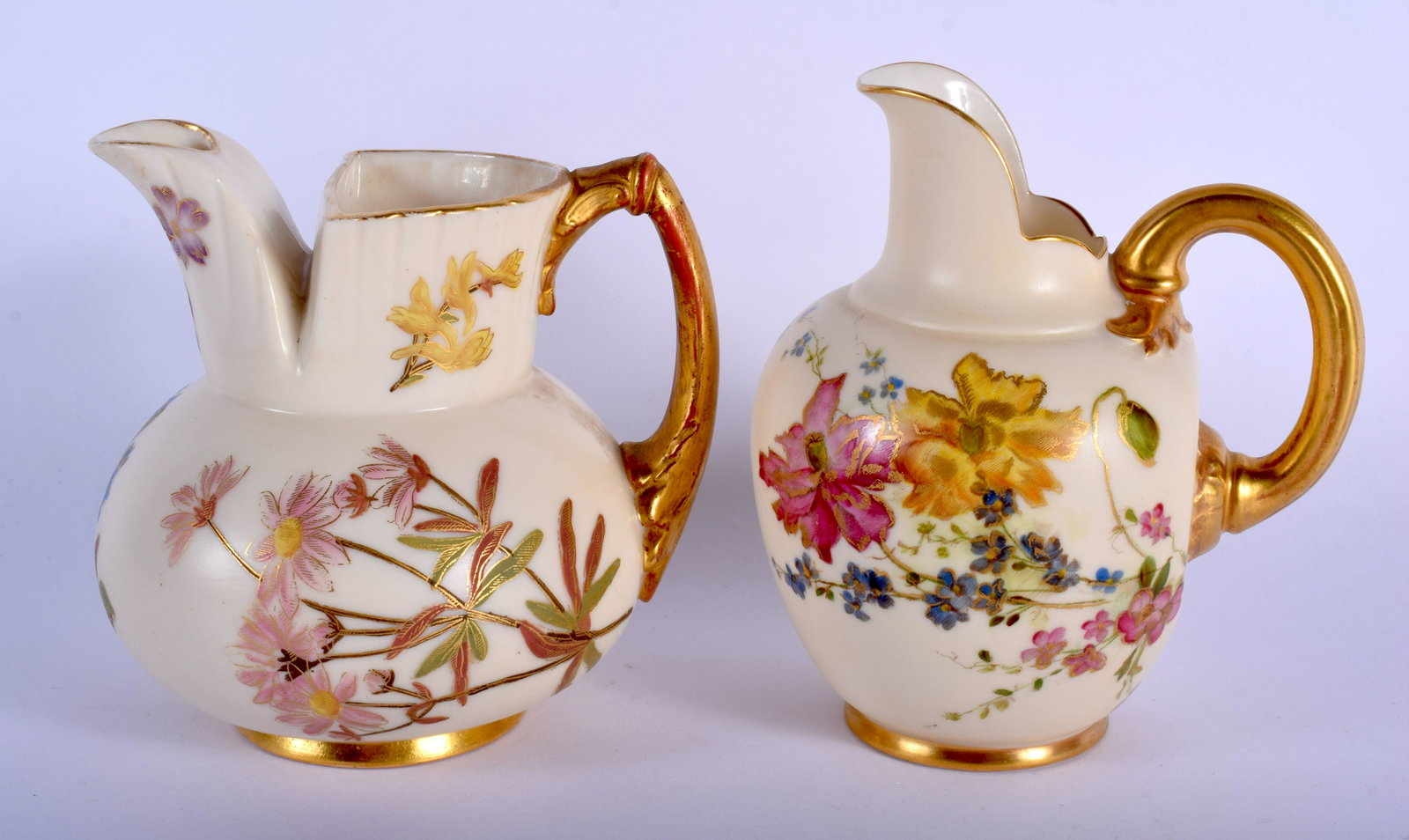 Royal Worcester flat a back jug painted with flowers on: Royal Worcester flat a back jug painted with flowers on an ivory ground c. 1899 and a another Royal Worcester jug shape 1438 painted with flowers on an ivory ground date code for 1893. 12cm high