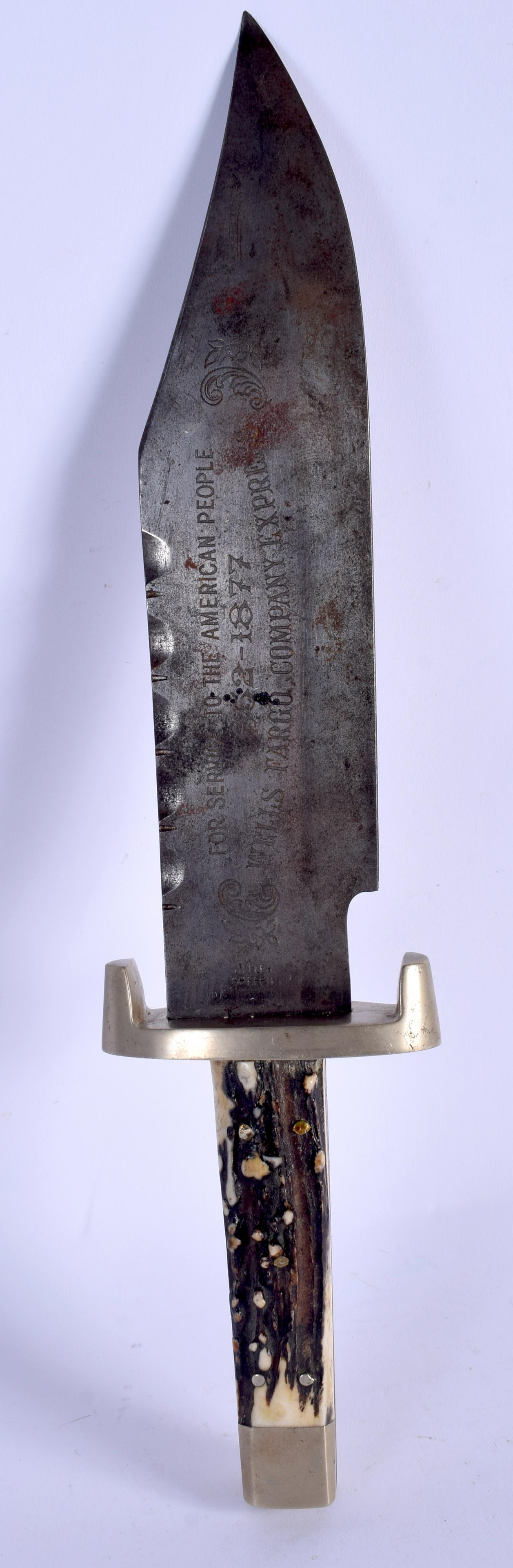 A RARE WELLS FARGO COMPANY EXPRESS HORN HANDLED BOWIE: A RARE WELLS FARGO COMPANY EXPRESS HORN HANDLED BOWIE KNIFE engraved with locomotives. 38 cm long.