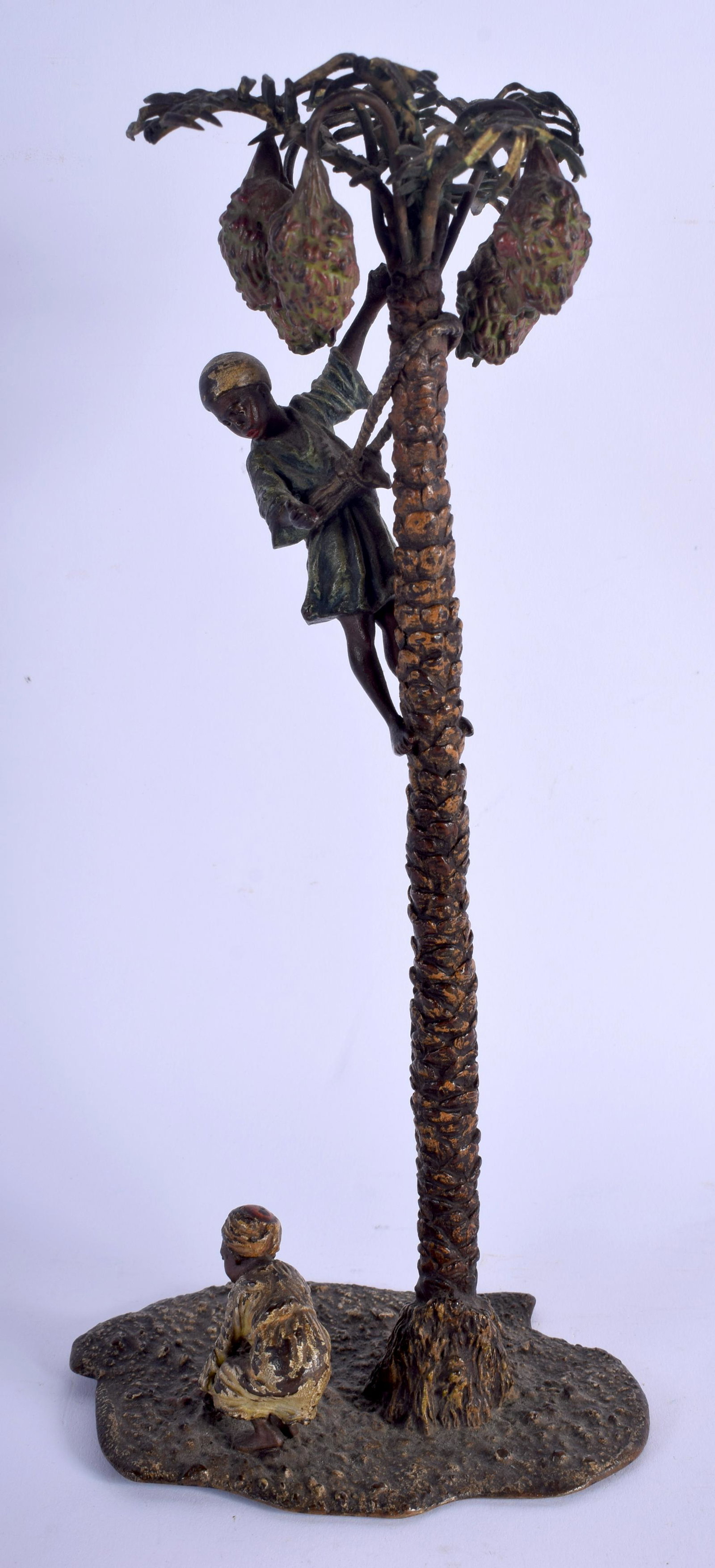 A LARGE CONTEMPORARY CONTINENTAL COLD PAINTED BRONZE: A LARGE CONTEMPORARY CONTINENTAL COLD PAINTED BRONZE PALM TREE modelled with two attendants. 26 cm high.