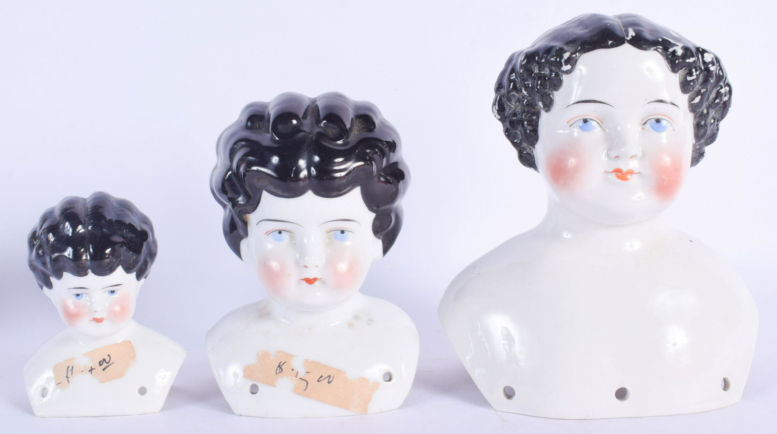 THREE EARLY 20TH CENTURY EUROPEAN PORCELAIN DOLL HEADS. (1 of 3)