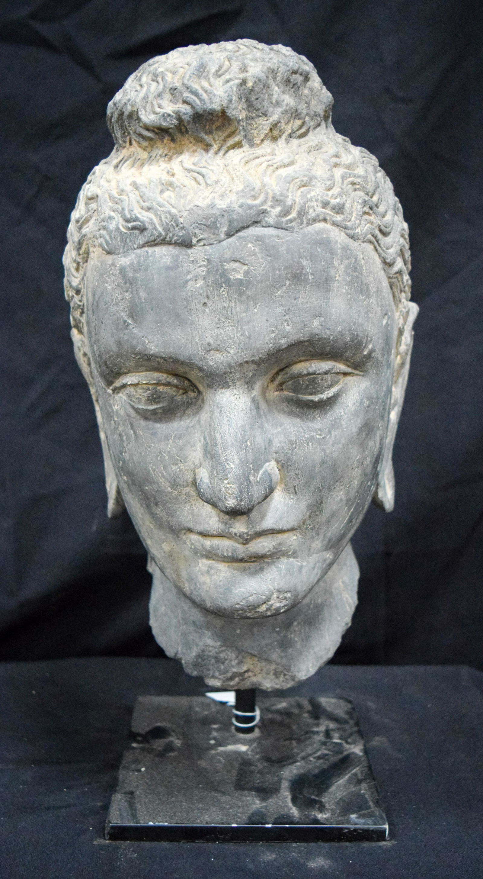 A Middle Eastern stone head on a base 40cm X 21 cm (1 of 3)