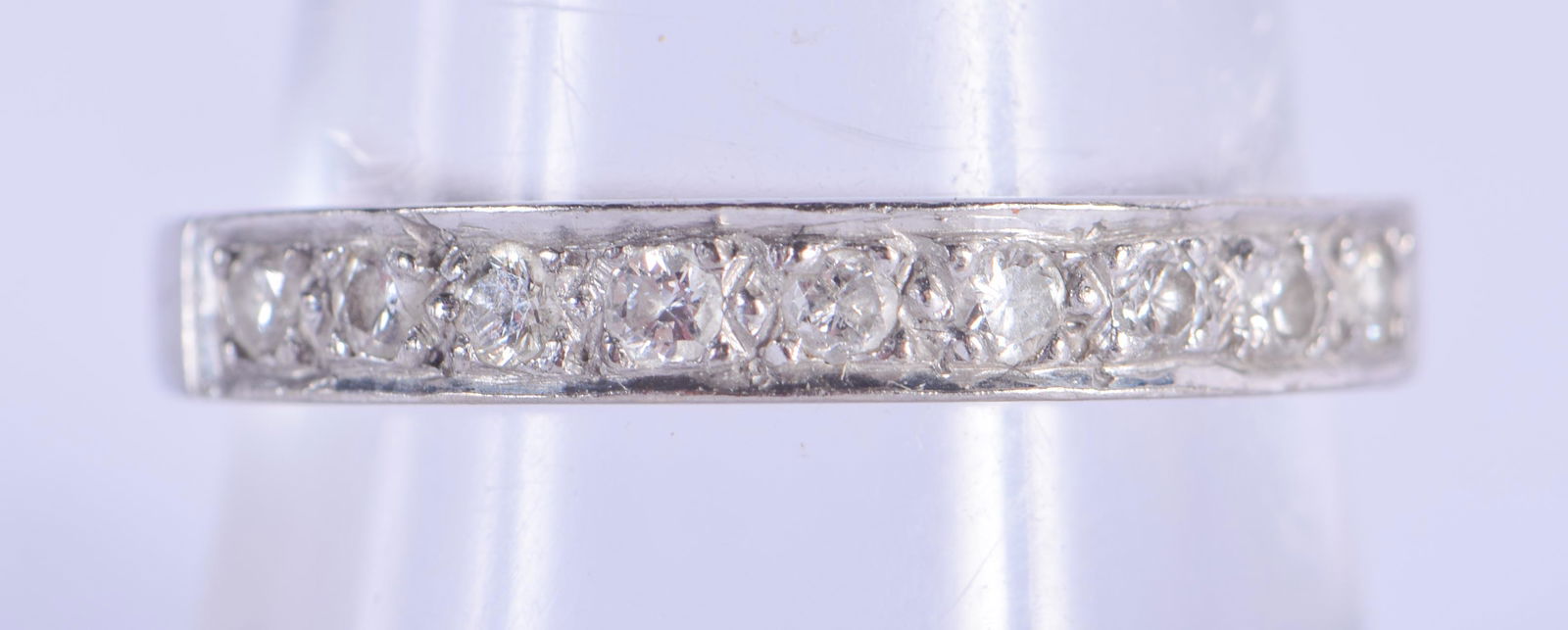 AN 18CT WHITE GOLD HALF ETERNITY RING. 3.4 grams. Q. (1 of 3)