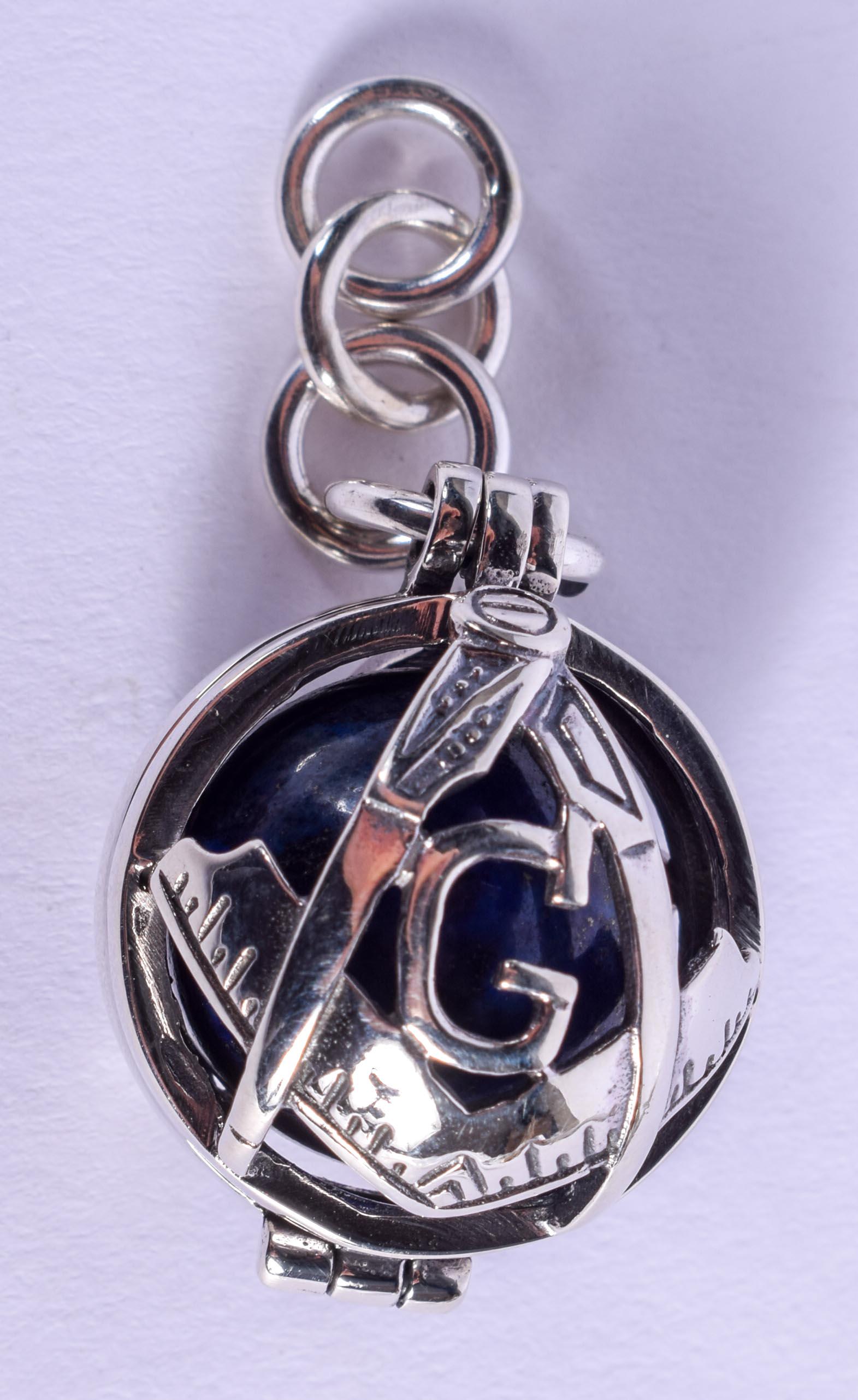 A SILVER MASONIC LAPIS LAZULI PENDANT. 2.5 cm diameter. (1 of 3)