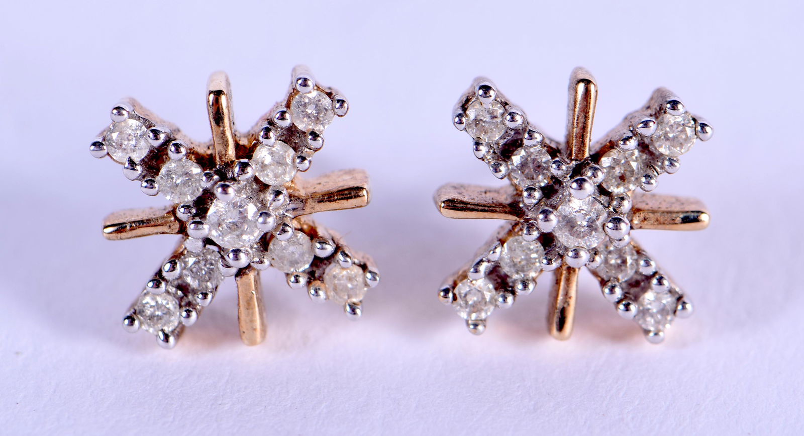 A PAIR OF 9CT GOLD AND DIAMOND EARRINGS of approx 0.3 (1 of 3)