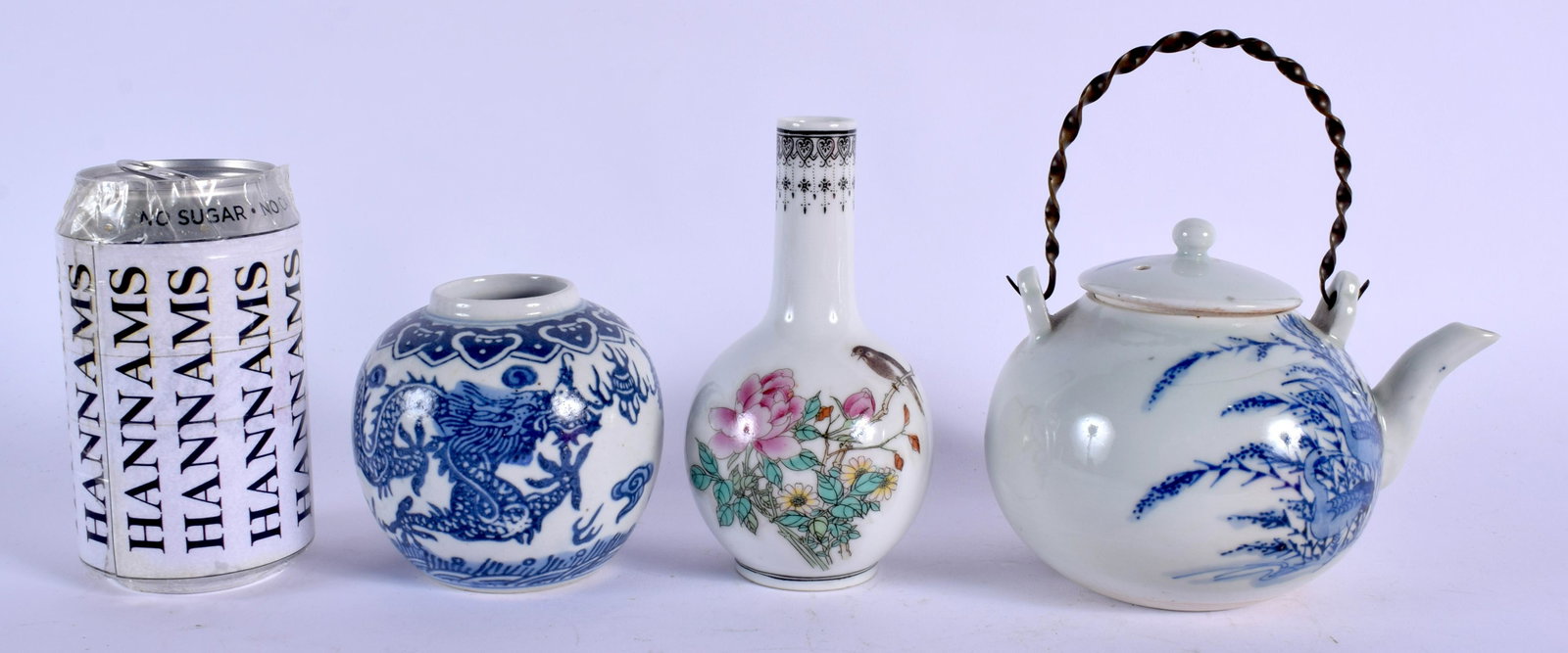 A 19TH CENTURY JAPANESE MEIJI PERIOD BLUE AND WHITE: A 19TH CENTURY JAPANESE MEIJI PERIOD BLUE AND WHITE TEAPOT AND COVER together with a Chinese vase etc. Largest 12.5 cm wide. (3)