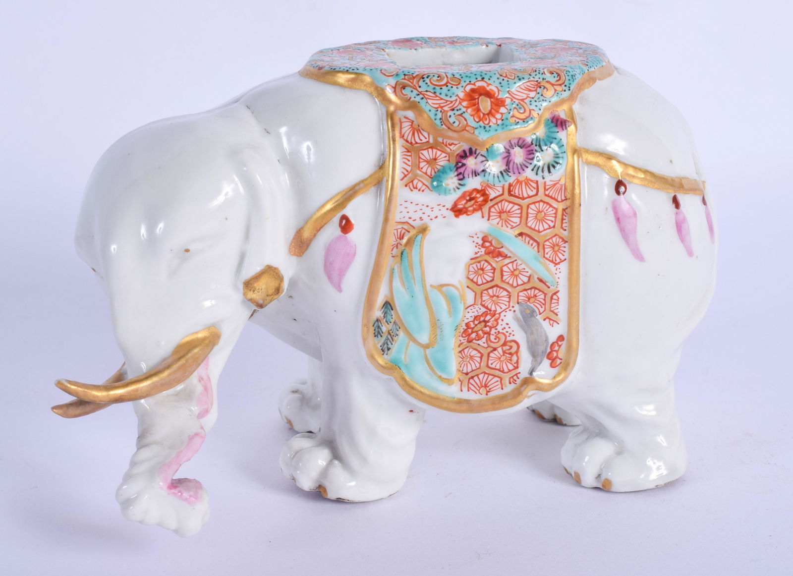 A RARE 19TH CENTURY FRENCH SAMSONS OF PARIS PORCELAIN: A RARE 19TH CENTURY FRENCH SAMSONS OF PARIS PORCELAIN ELEPHANT painted with floral sprays. 13 cm wide.