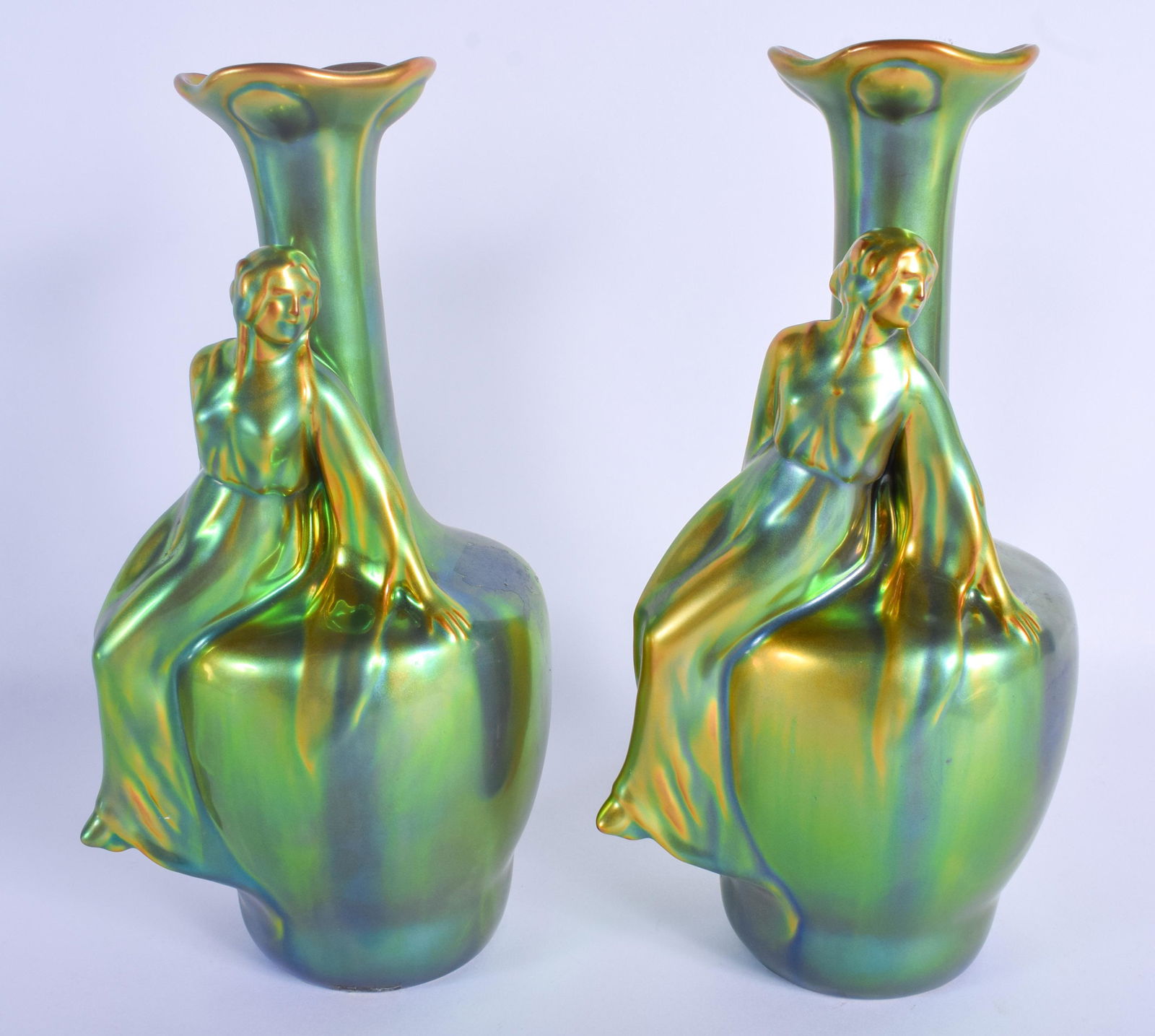 A RARE PAIR OF HUNGARIAN ZSOLNAY PECS PORCELAIN VASES: A RARE PAIR OF HUNGARIAN ZSOLNAY PECS PORCELAIN VASES of iridescent form. 24 cm high.