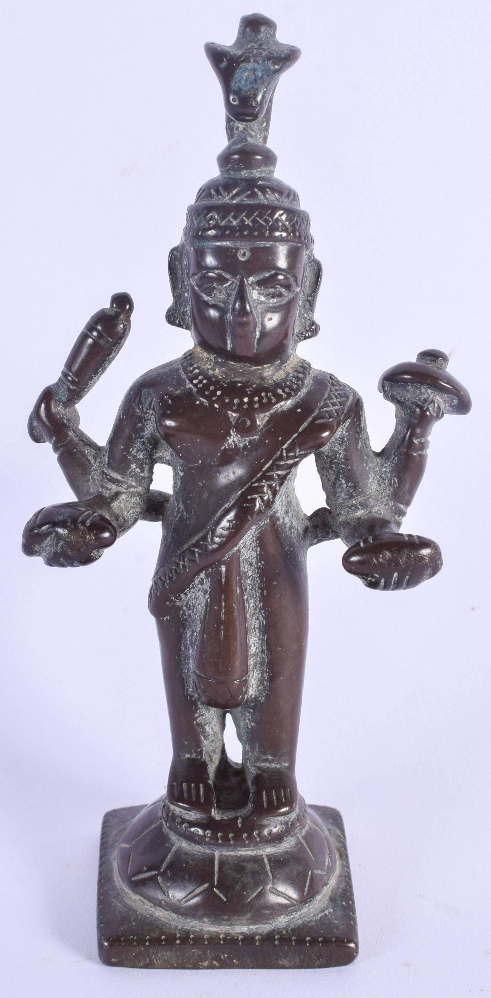 AN 18TH CENTURY INDO TIBETAN BRONZE FIGURE OF A: AN 18TH CENTURY INDO TIBETAN BRONZE FIGURE OF A BUDDHISTIC DEITY modelled upon a square base. 14 cm high.