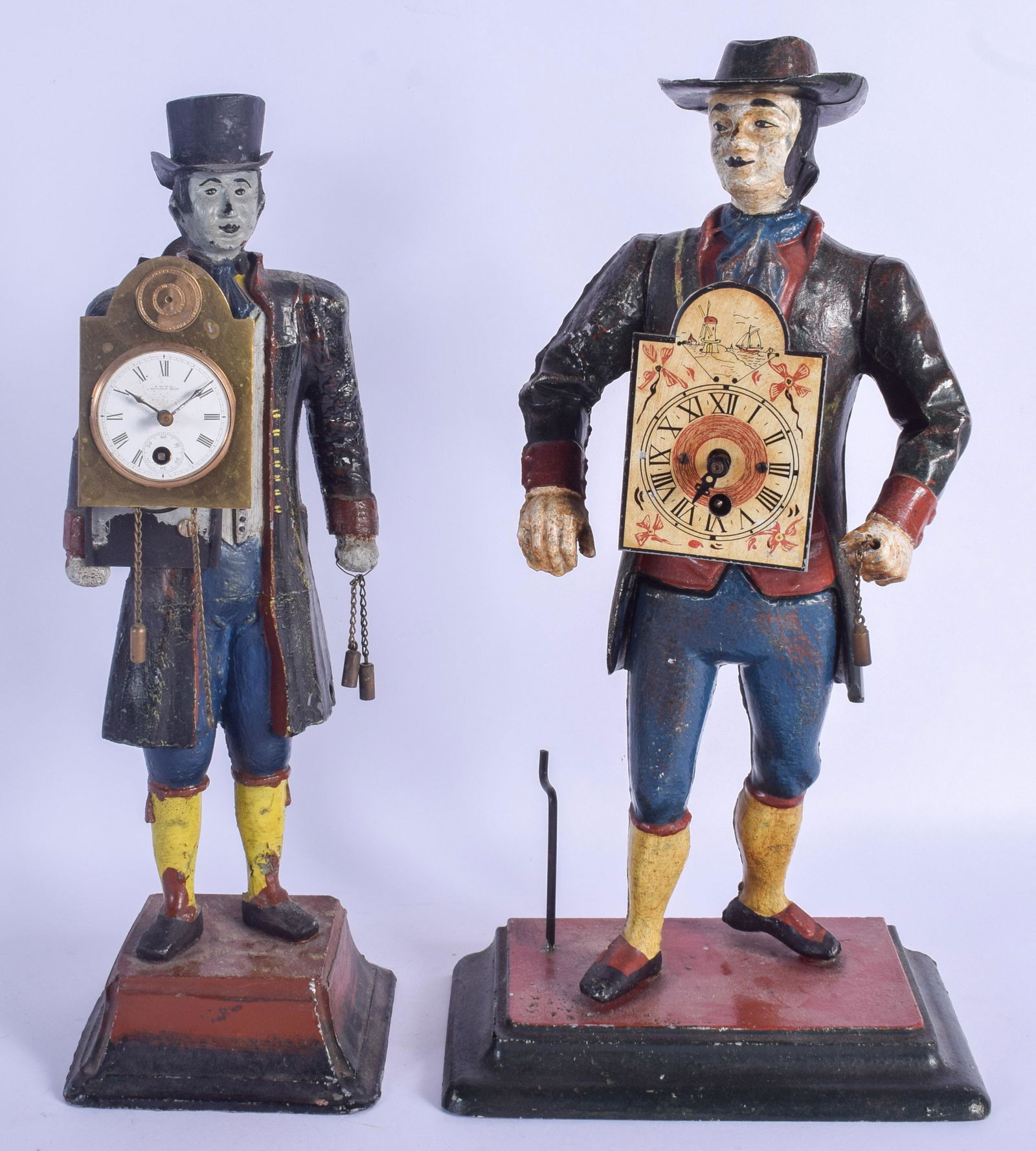 TWO AMERICAN PAINTED CAST IRON FIGURAL CLOCKS each (1 of 2)