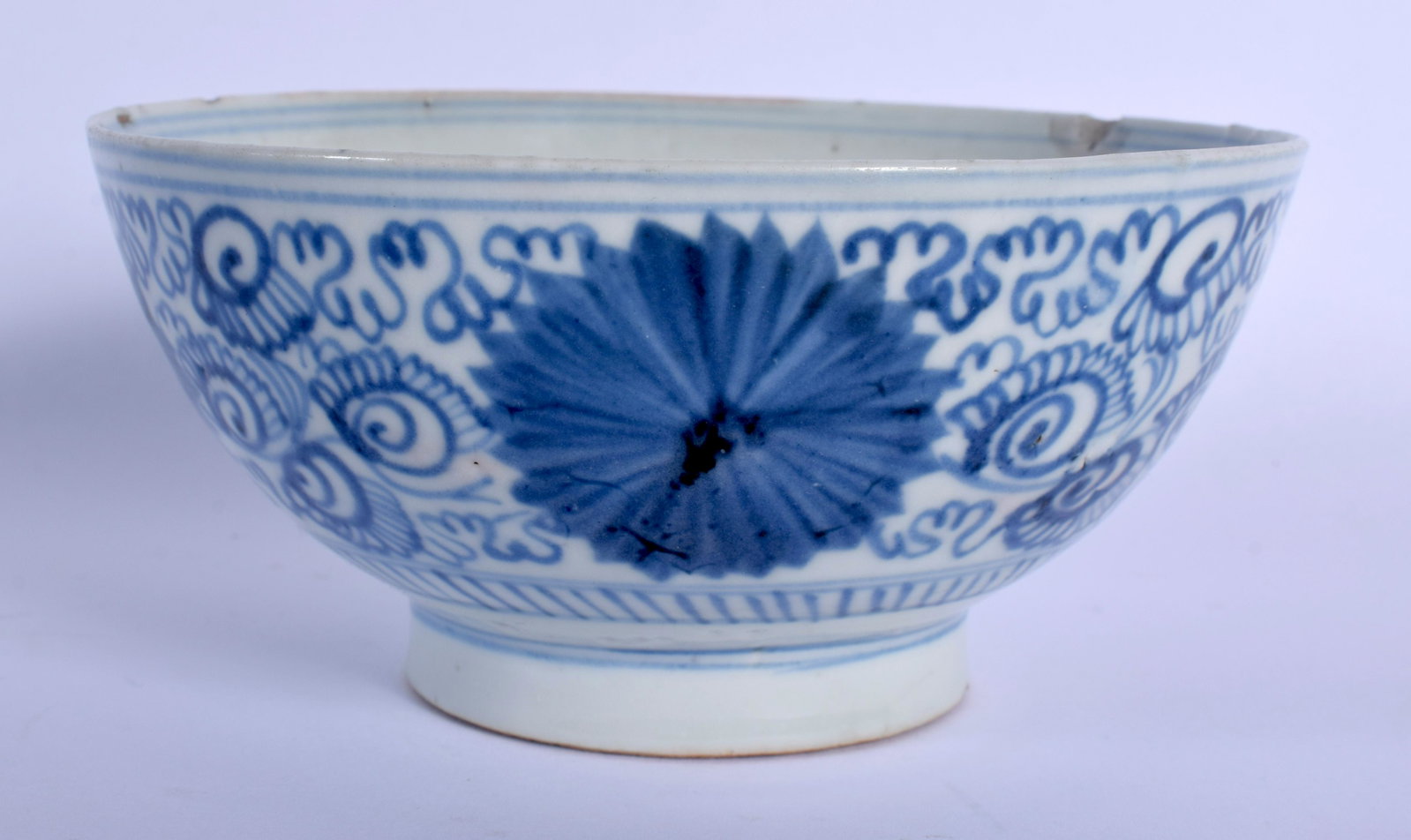 AN 18TH/19TH CENTURY CHINESE BLUE AND WHITE PORCELAIN: AN 18TH/19TH CENTURY CHINESE BLUE AND WHITE PORCELAIN BOWL possibly Korean, painted with floral scrolls. 14.5 cm diameter.