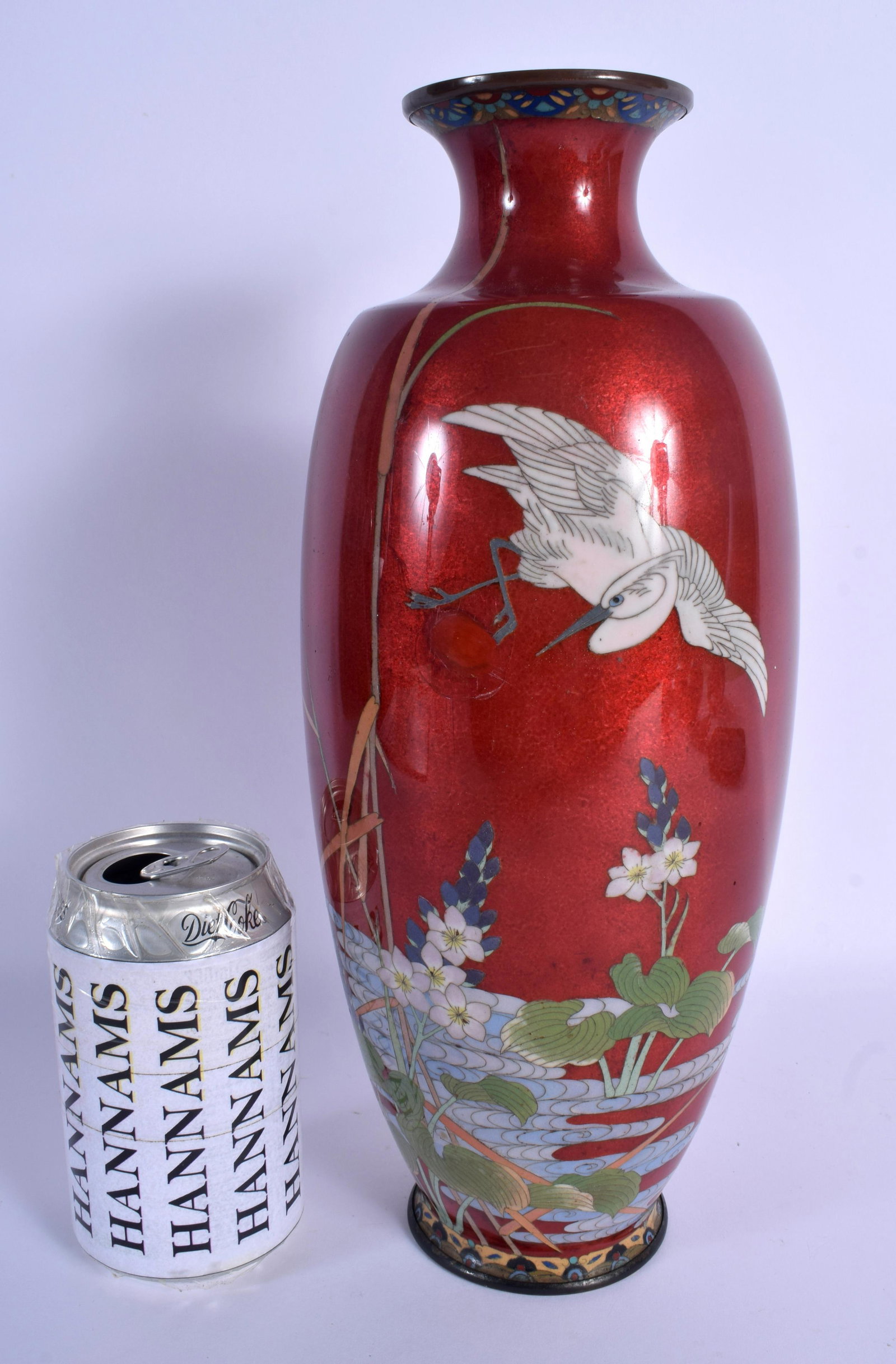 A 19TH CENTURY JAPANESE MEIJI PERIOD CLOISONNE ENAMEL: A 19TH CENTURY JAPANESE MEIJI PERIOD CLOISONNE ENAMEL VASE decorated with a bird in flight. 32 cm high.