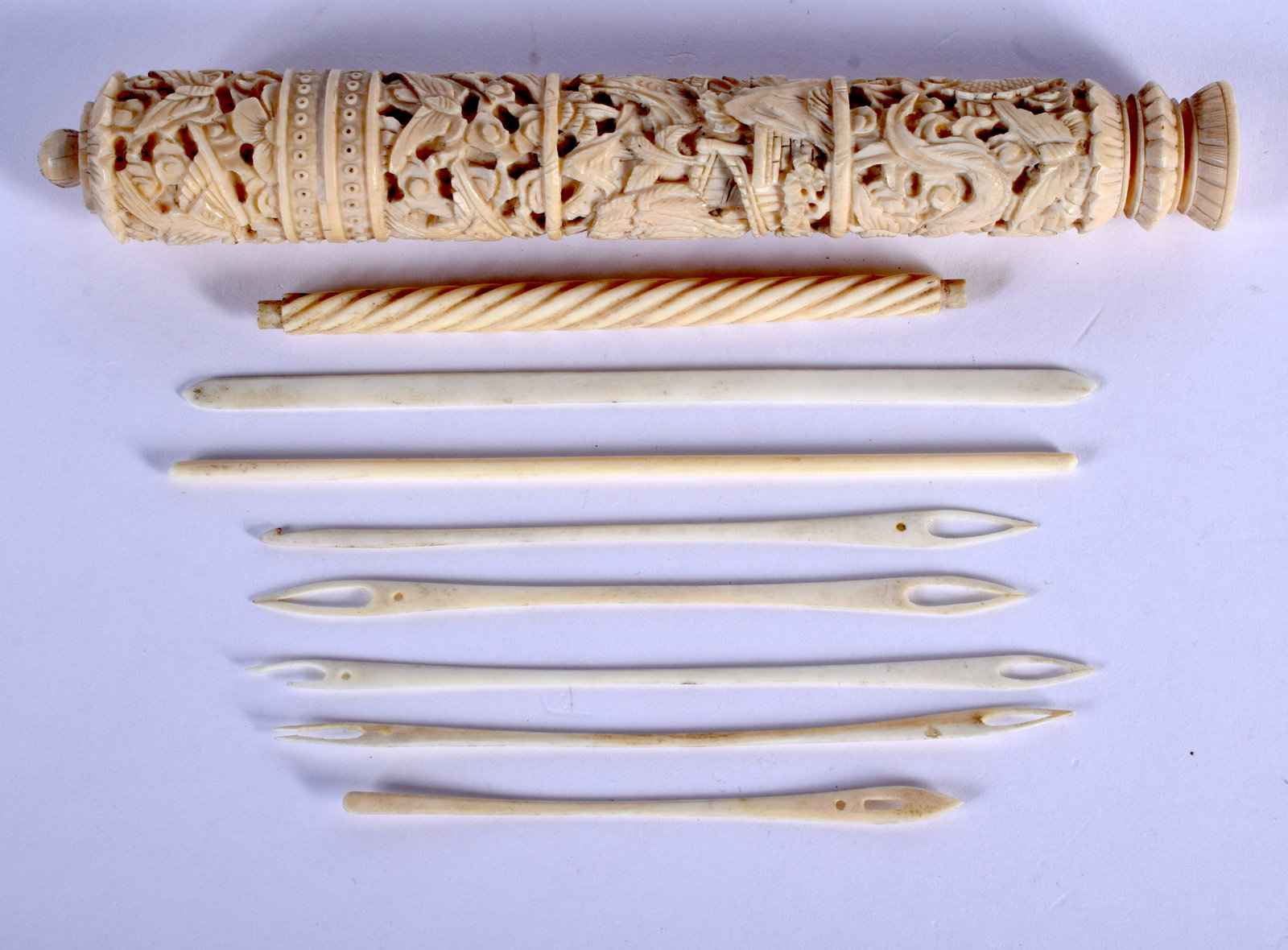 A 19TH CENTURY CHINESE CANTON BONE NEEDLE CASE AND: A 19TH CENTURY CHINESE CANTON BONE NEEDLE CASE AND COVER Qing. 14 cm long.