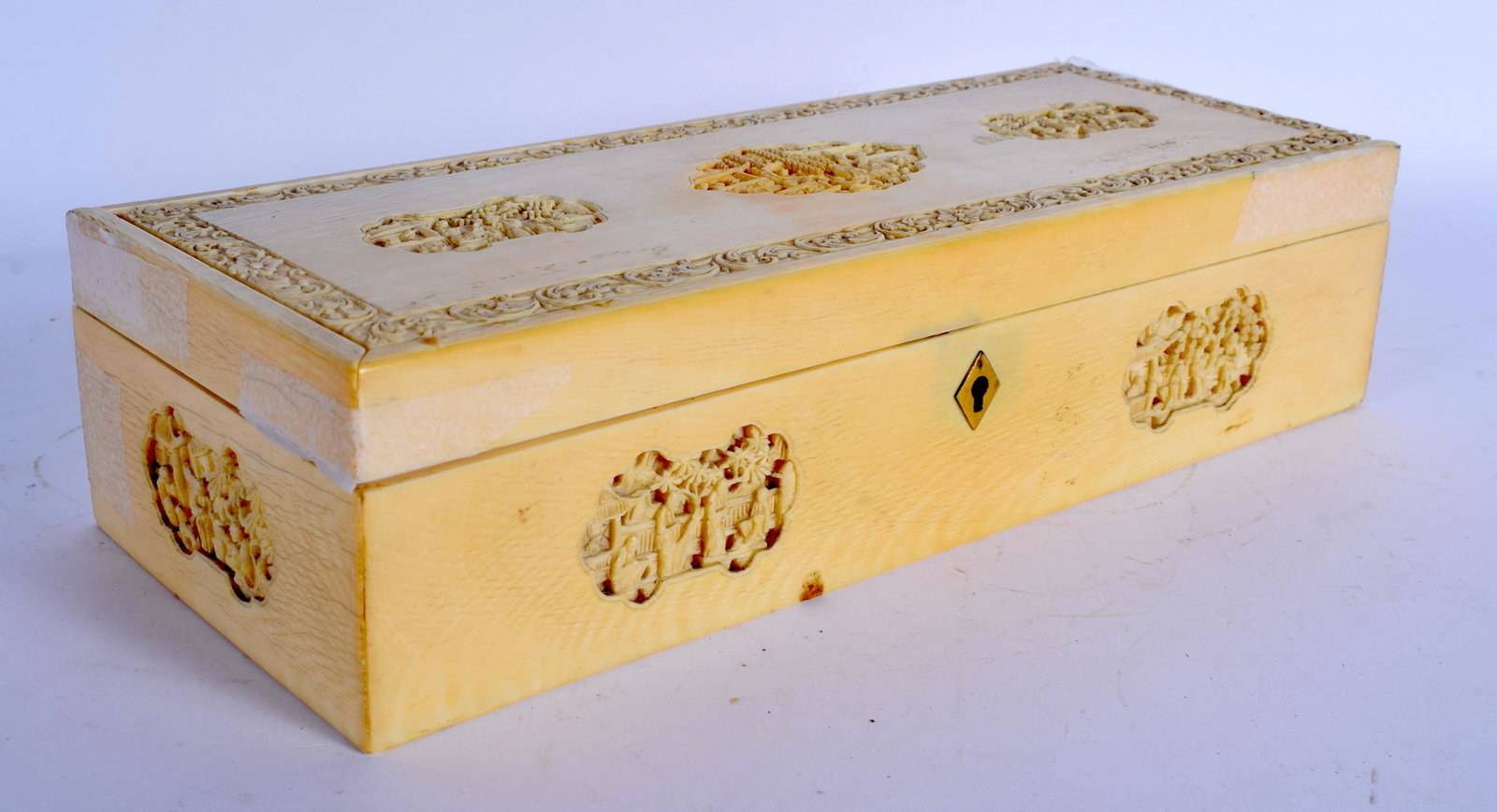 A 19TH CENTURY CHINESE CANTON CARVED BONE RECTANGULAR: A 19TH CENTURY CHINESE CANTON CARVED BONE RECTANGULAR BOX Qing, carved with figures and landscapes. 24 cm x 9 cm.