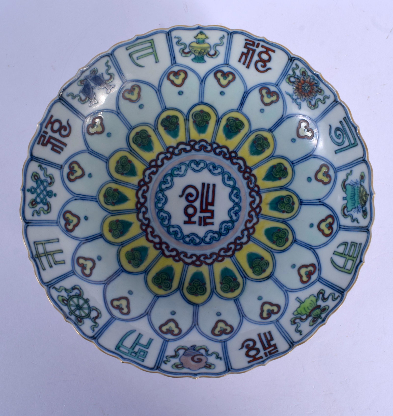A VERY RARE CHINESE QING DYNASTY OGEE FORM DOUCAI: A VERY RARE CHINESE QING DYNASTY OGEE FORM DOUCAI SCALLOPED DISH bearing Yongzheng marks to base. 19 cm wide.
