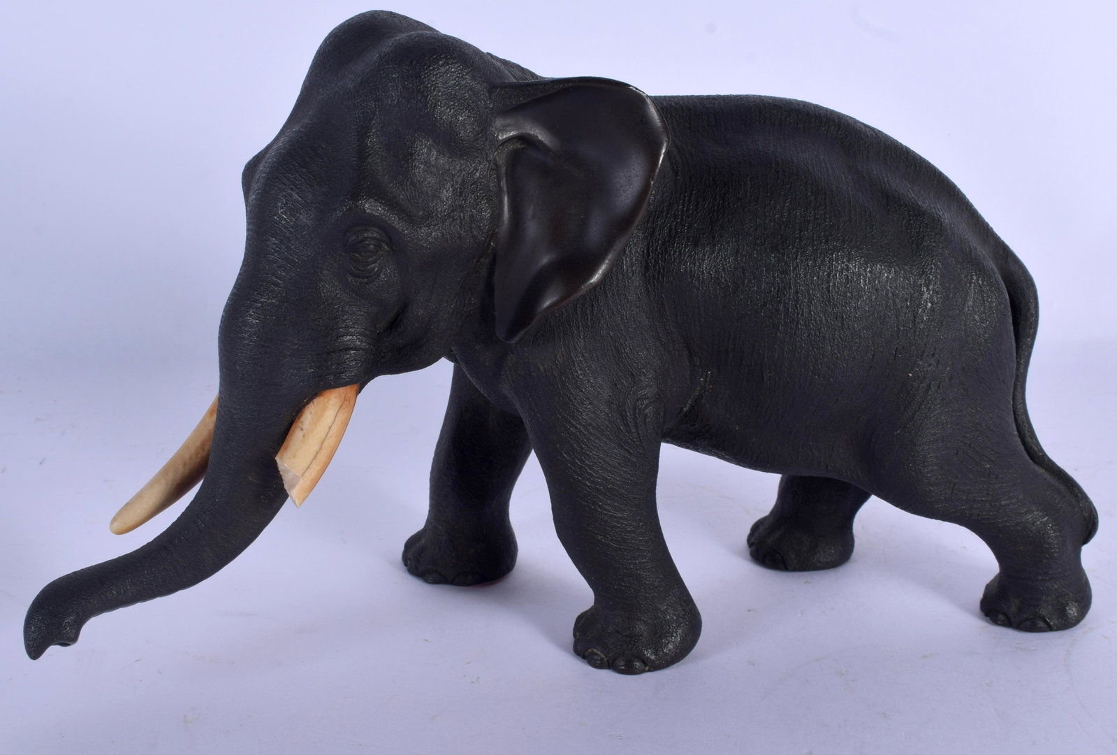 A 19TH CENTURY JAPANESE MEIJI PERIOD BRONZE OKIMONO: A 19TH CENTURY JAPANESE MEIJI PERIOD BRONZE OKIMONO modelled roaming. 27 cm x 18 cm.