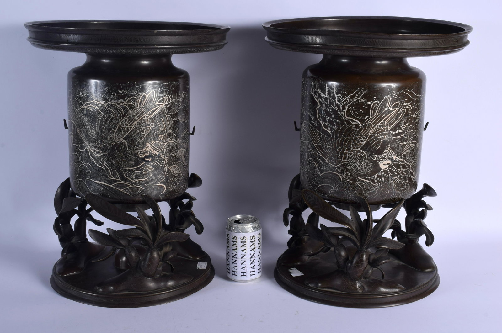 A LARGE PAIR OF 19TH CENTURY JAPANESE MEIJI PERIOD: A LARGE PAIR OF 19TH CENTURY JAPANESE MEIJI PERIOD SILVER INLAID VASES ON STANDS decorated with hawks and foliage. 53 cm x 32 cm.
