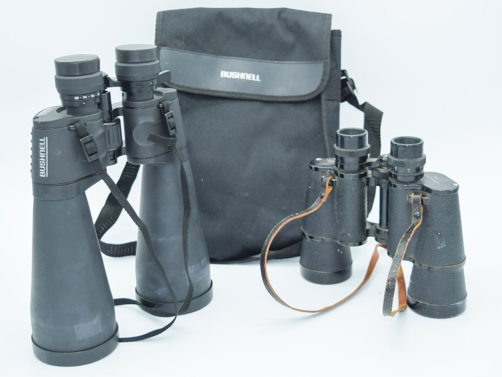 A pair of Bushnell binoculars together with Optomax (1 of 3)