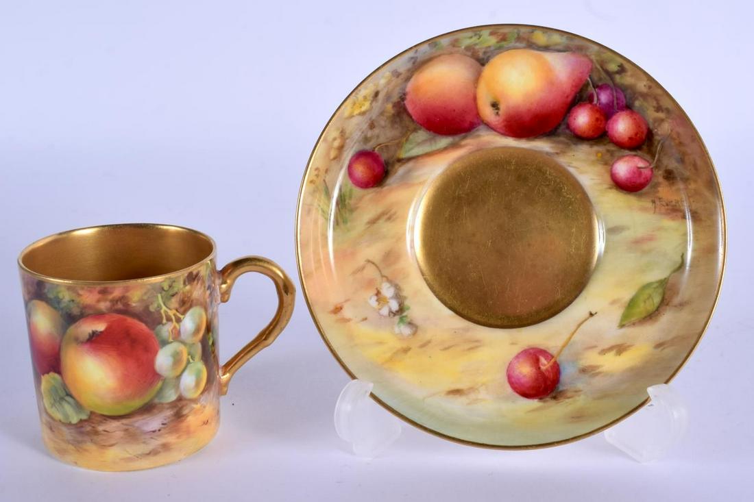 Royal Worcester coffee can and saucer painted with: Royal Worcester coffee can and saucer painted with fruit by Harry Ayrton and Hilda Everette c. 1925. Cup 5.5cm high, Saucer 11.5cm wide