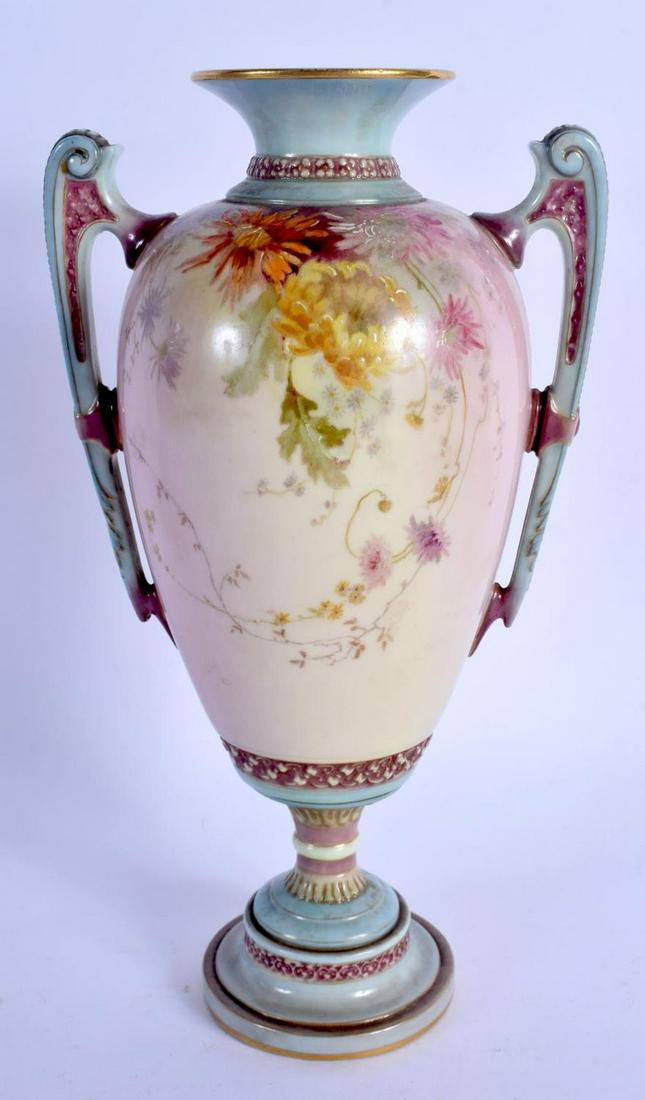 Royal Worcester two handled vase painted in prismatic: Royal Worcester two handled vase painted in prismatic enamels with flowers date code 1894. 25cm high