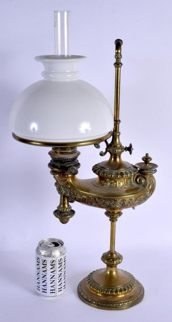 A RARE 19TH CENTURY BRONZE GENIE TYPE OIL LAMP by Wild: A RARE 19TH CENTURY BRONZE GENIE TYPE OIL LAMP by Wild and Wessel of Berlin, overlaid with foliage and vines. 52 cm high not inc funnel.