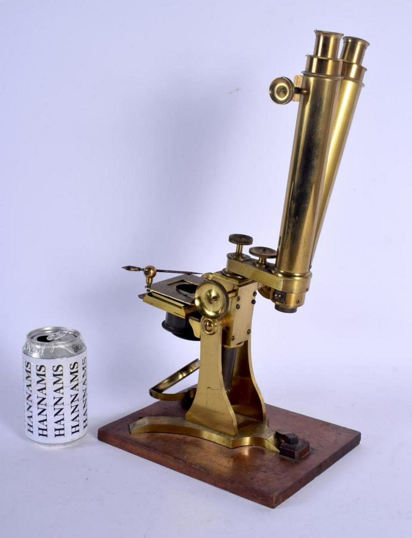 A LARGE JAMES HOW & CO OF LONDON DOUBLE MICROSCOPE upon: A LARGE JAMES HOW & CO OF LONDON DOUBLE MICROSCOPE upon a wooden plinth. 41 cm high.