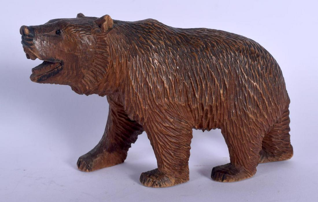 A BAVARIAN BLACK FOREST CARVED WOOD FIGURE OF A BEAR.: A BAVARIAN BLACK FOREST CARVED WOOD FIGURE OF A BEAR. 14 cm x 11 cm.