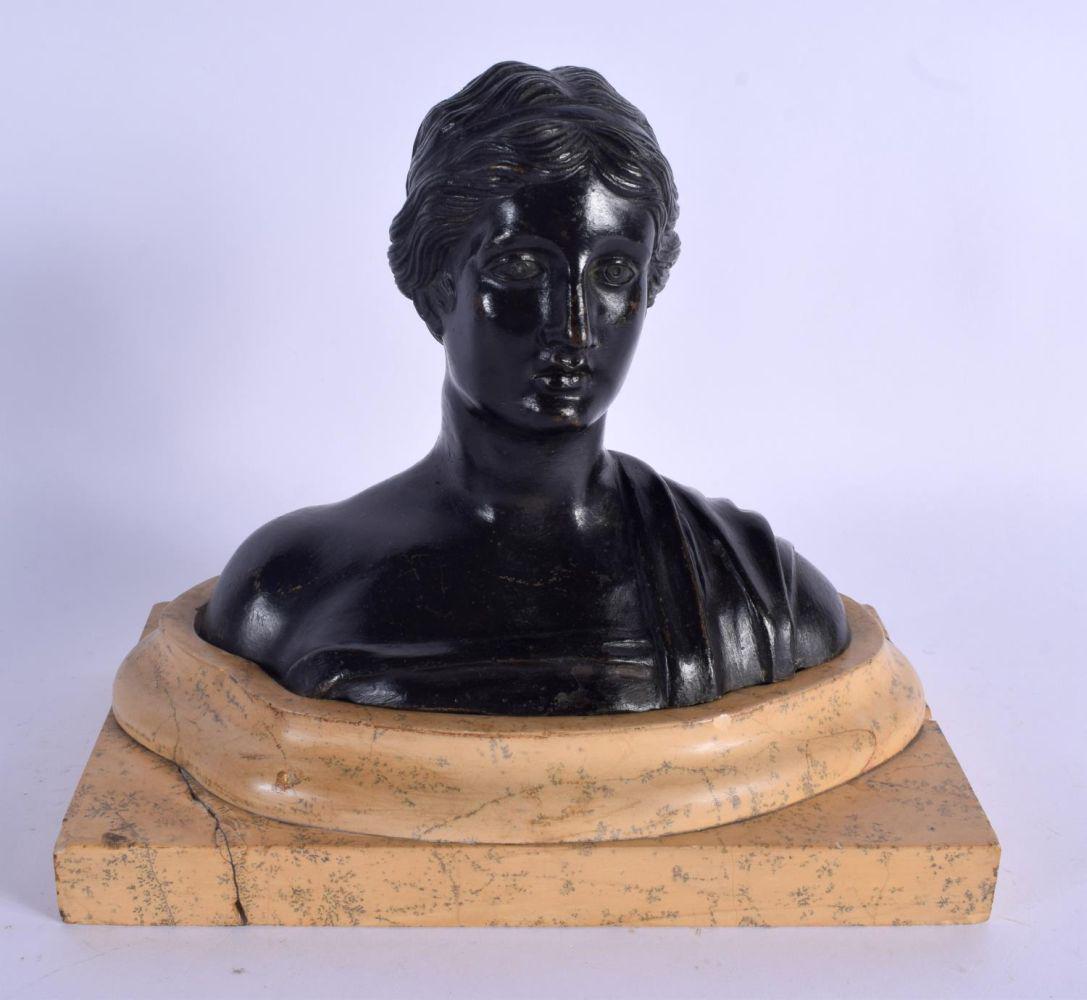 A 19TH CENTURY EUROPEAN BRONZE BUST OF A CLASSICAL: A 19TH CENTURY EUROPEAN BRONZE BUST OF A CLASSICAL FEMALE modelled upon a fitted marble base. Bronze 15 cm x 15 cm.