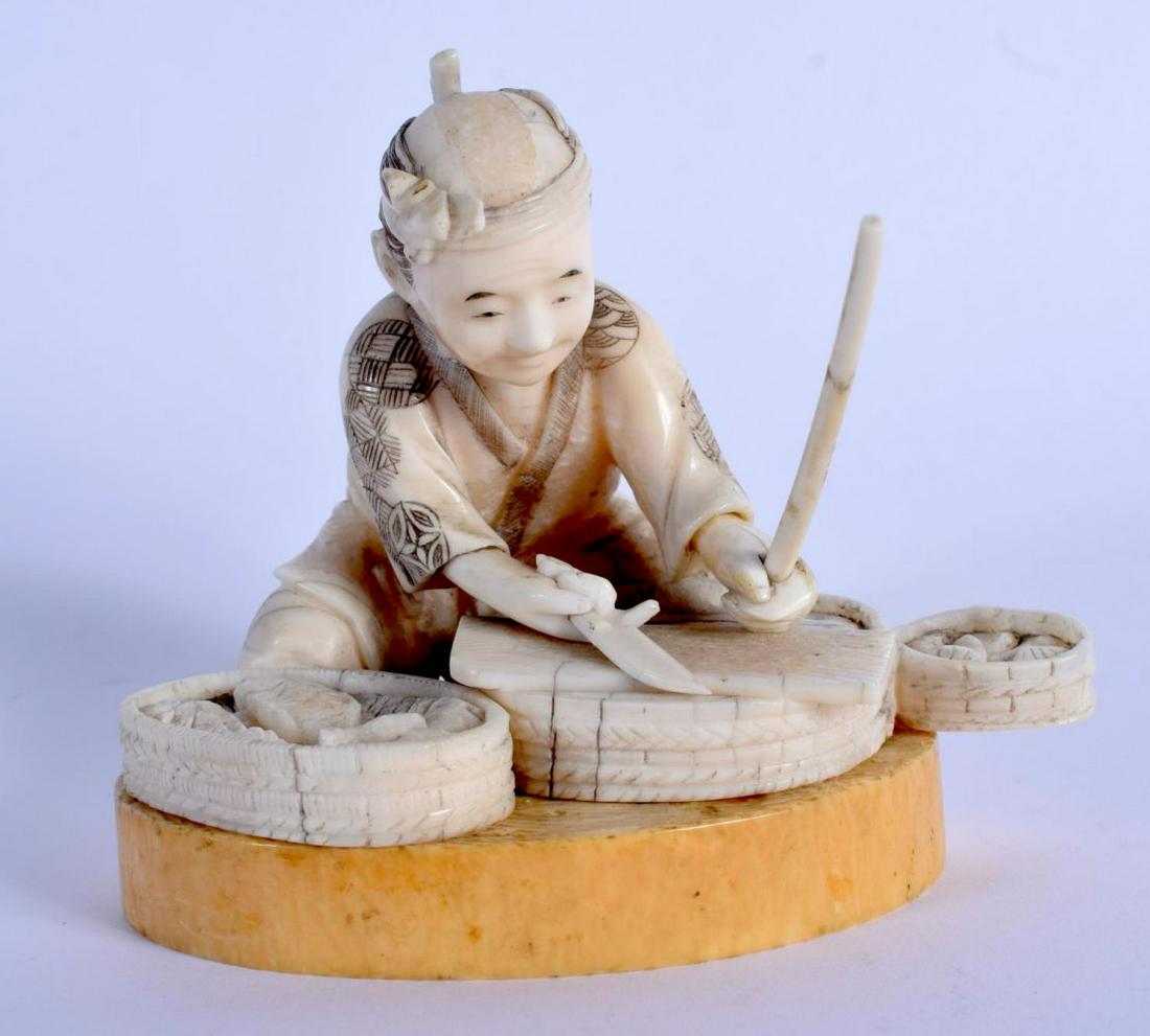 A 19TH CENTURY JAPANESE MEIJI PERIOD CARVED BONE FIGURE: A 19TH CENTURY JAPANESE MEIJI PERIOD CARVED BONE FIGURE OF A MALE modelled preparing fish. 8 cm x 9 cm.