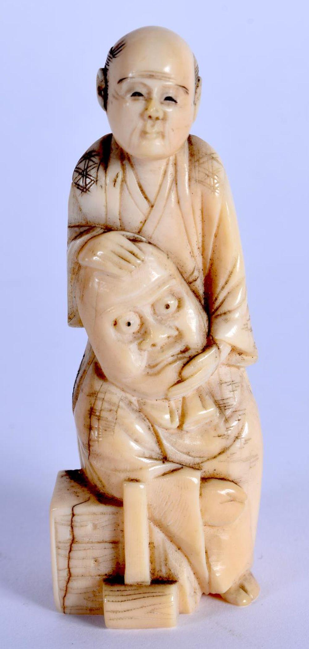 A 19TH CENTURY JAPANESE MEIJI PERIOD CARVED BONE: A 19TH CENTURY JAPANESE MEIJI PERIOD CARVED BONE OKIMONO. 6 cm high.