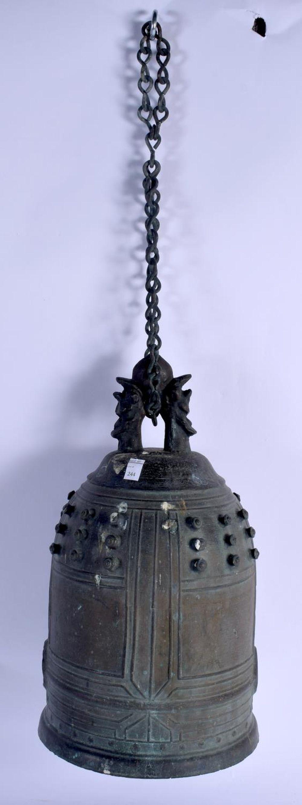 AN 18TH CENTURY JAPANESE EDO PERIOD BRONZE BELL with: AN 18TH CENTURY JAPANESE EDO PERIOD BRONZE BELL with dimpled decoration. 33 cm x 16 cm.