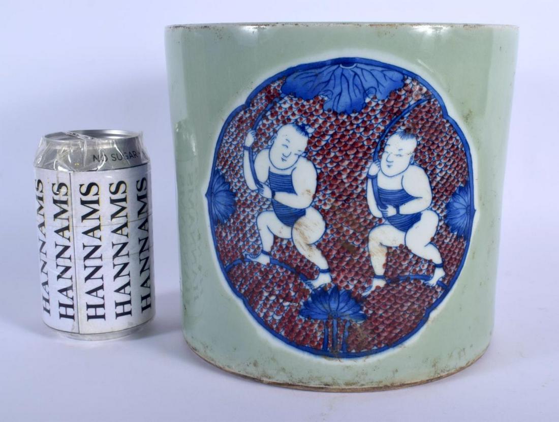 A LARGE CHINESE CELADON BLUE AND WHITE PORCELAIN BRUSH: A LARGE CHINESE CELADON BLUE AND WHITE PORCELAIN BRUSH POT Bitong, 20th Century, painted with the hehe erxian twins. 18 cm x 15 cm.