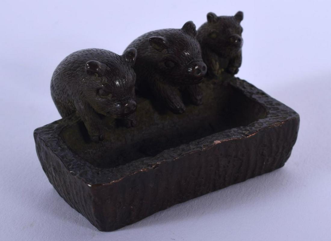 A JAPANESE BRONZE PIG TROUGH OKIMONO. 4 cm x 3 cm.: A JAPANESE BRONZE PIG TROUGH OKIMONO. 4 cm x 3 cm.