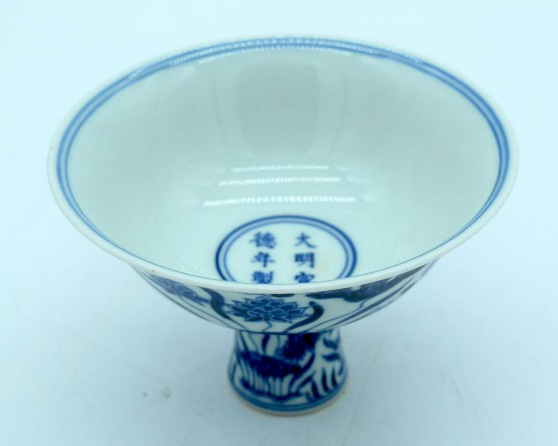 A Chinese blue and white stem cup decorated with fish. (1 of 6)