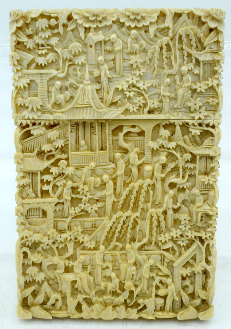 A MID 19TH CENTURY CHINESE CANTON CARVED BONE CARD CASE: A MID 19TH CENTURY CHINESE CANTON CARVED BONE CARD CASE AND COVER Qing, decorated with figures in various pursuits. 12 cm x 7.5 cm.