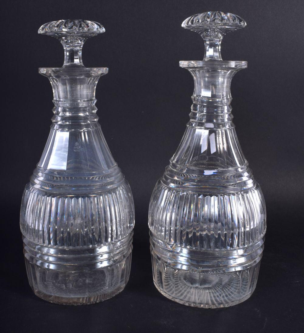 A PAIR OF GEORGE III CUT GLASS DECANTERS. 22 cm high. (1 of 4)