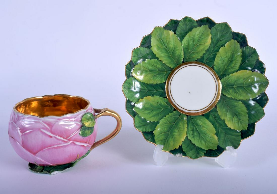 A RARE 19TH CENTURY MEISSEN PORCELAIN ARTICHOKE MOULDED: A RARE 19TH CENTURY MEISSEN PORCELAIN ARTICHOKE MOULDED CUP AND SAUCER of naturalistic form, with gilt interior. 12 cm wide.