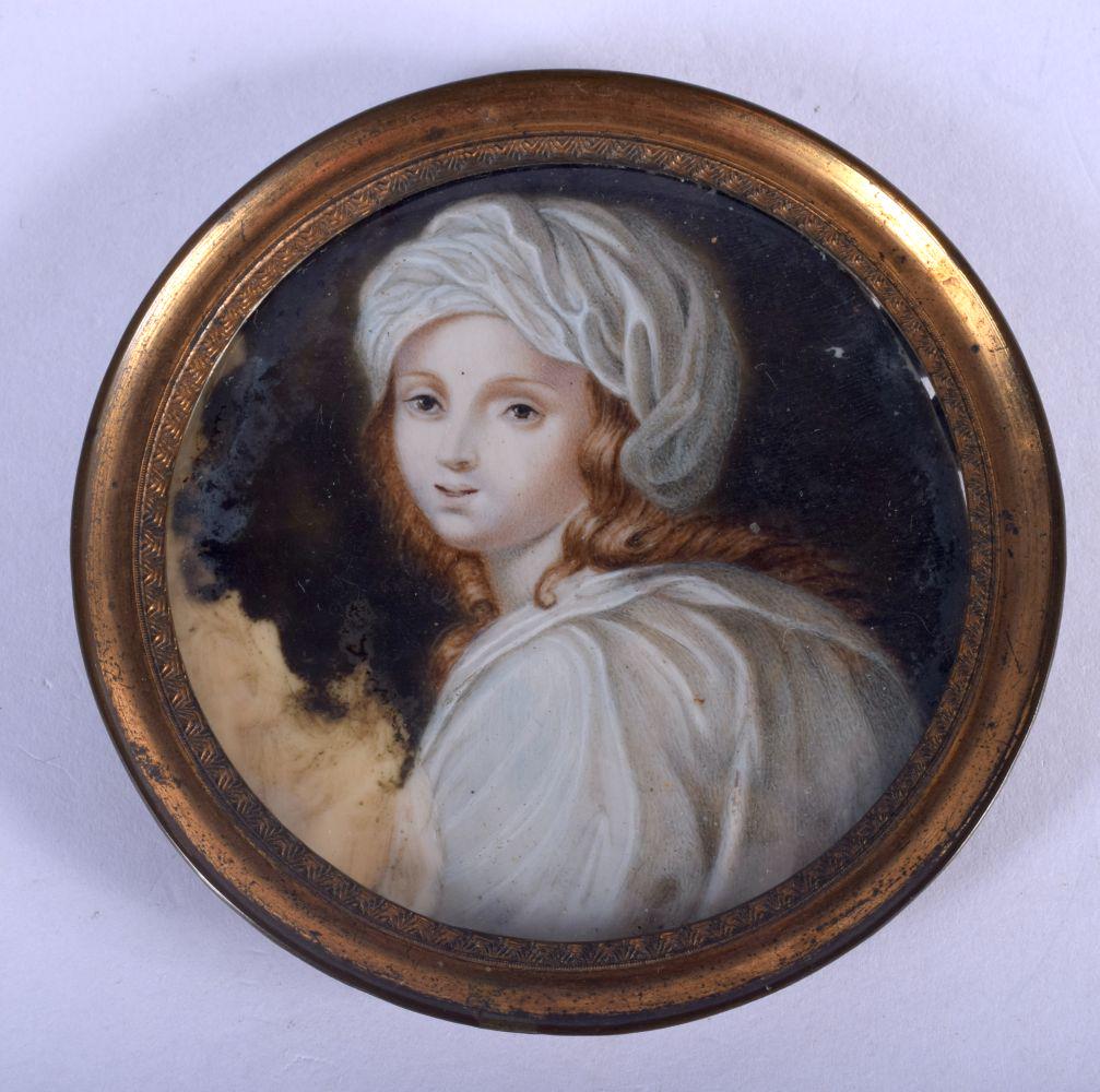 AN ANTIQUE PAINTED BONE PORTRAIT MINIATURE painted with: AN ANTIQUE PAINTED BONE PORTRAIT MINIATURE painted with a pretty female. 6.5 cm diameter.