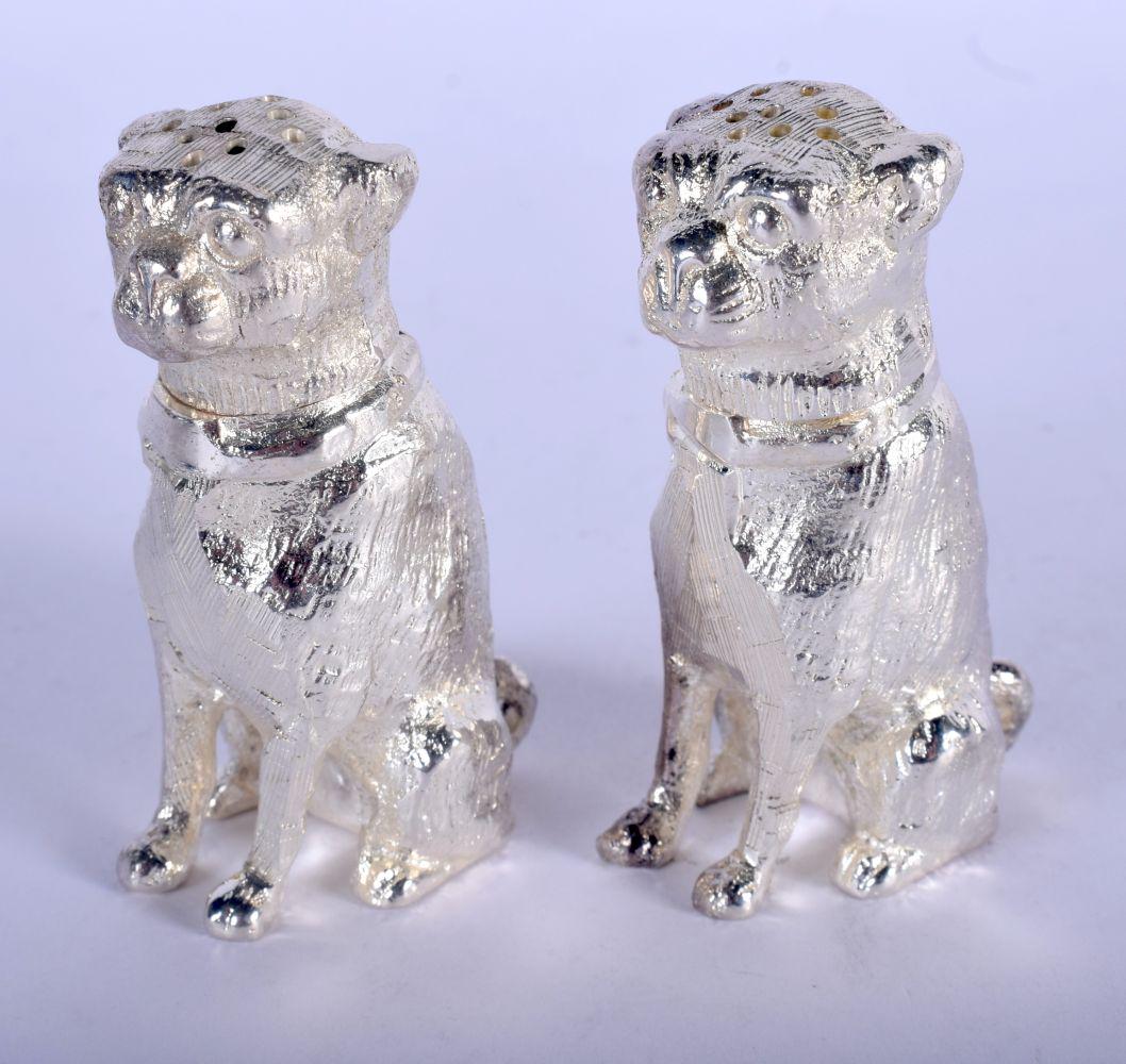 A PAIR OF SILVER PLATED DOG CONDIMENTS. 8 cm x 5 cm. (1 of 3)
