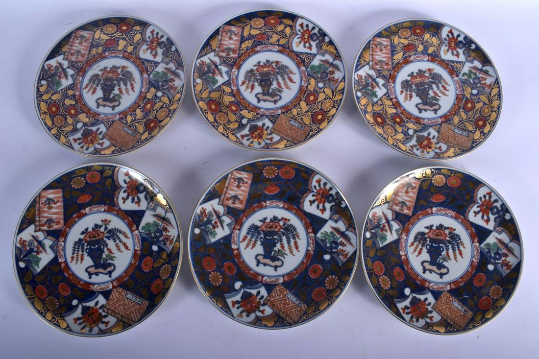 SIX 19TH CENTURY JAPANESE MEIJI PERIOD IMARI DISHES: SIX 19TH CENTURY JAPANESE MEIJI PERIOD IMARI DISHES painted with floral sprays and vines. 25 cm diameter. (6)
