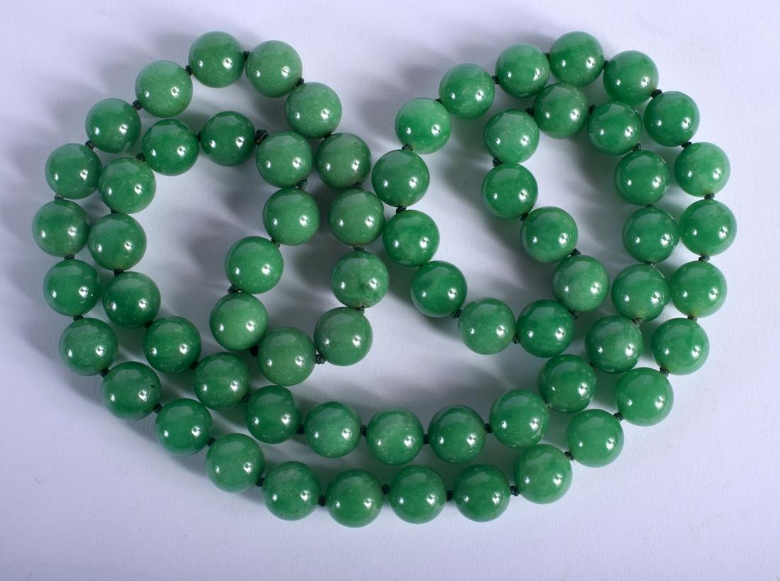 A CHINESE JADEITE NECKLACE 20th Century. 80 cm long, (1 of 2)