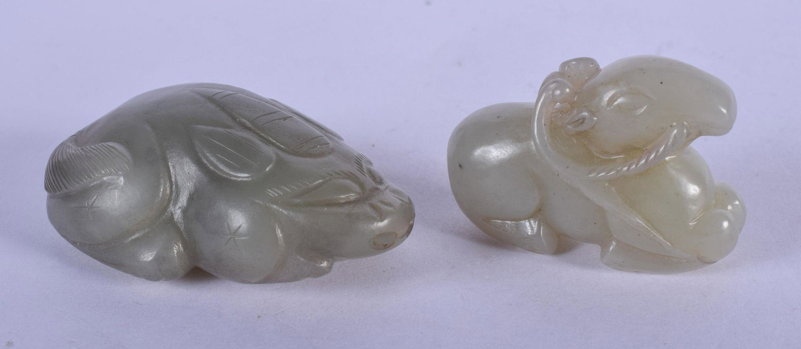 TWO CHINESE CARVED JADE BEASTS 20th Century. Largest: TWO CHINESE CARVED JADE BEASTS 20th Century. Largest 6.5 cm x 4 cm. (2)