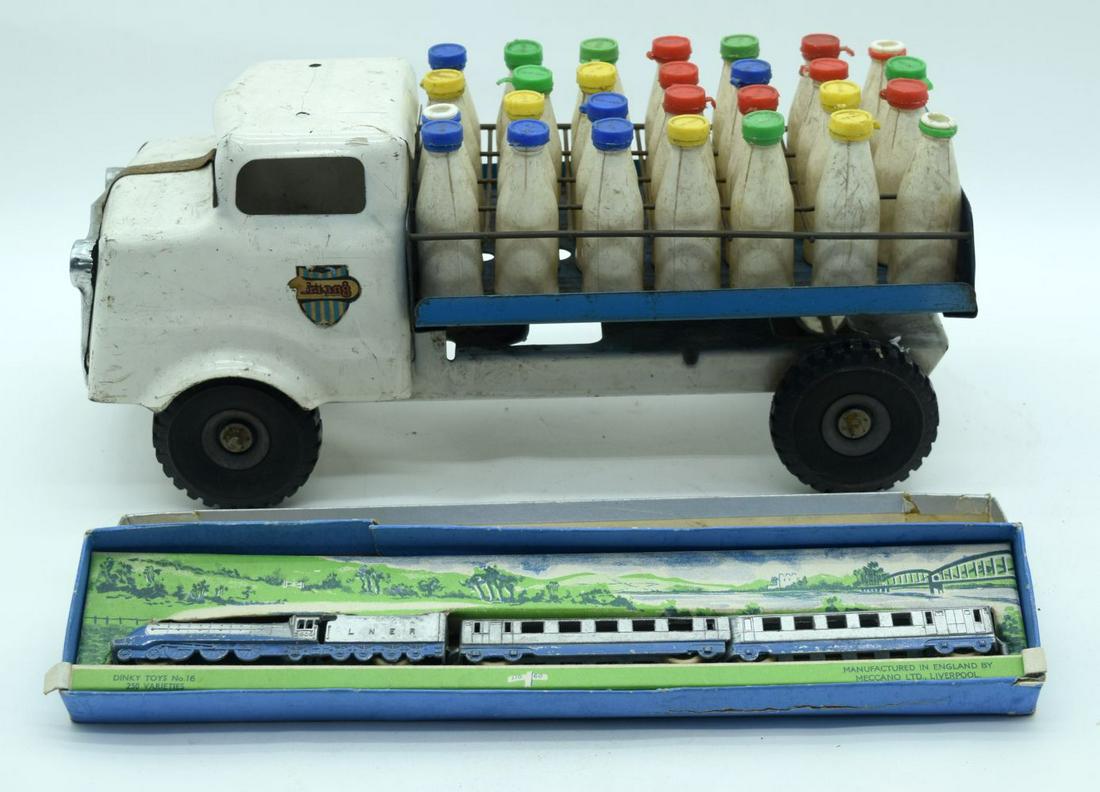 A Vintage Triang milk cart together with a Dinky Silver: A Vintage Triang milk cart together with a Dinky Silver Jubilee Train set 36cm (2).
