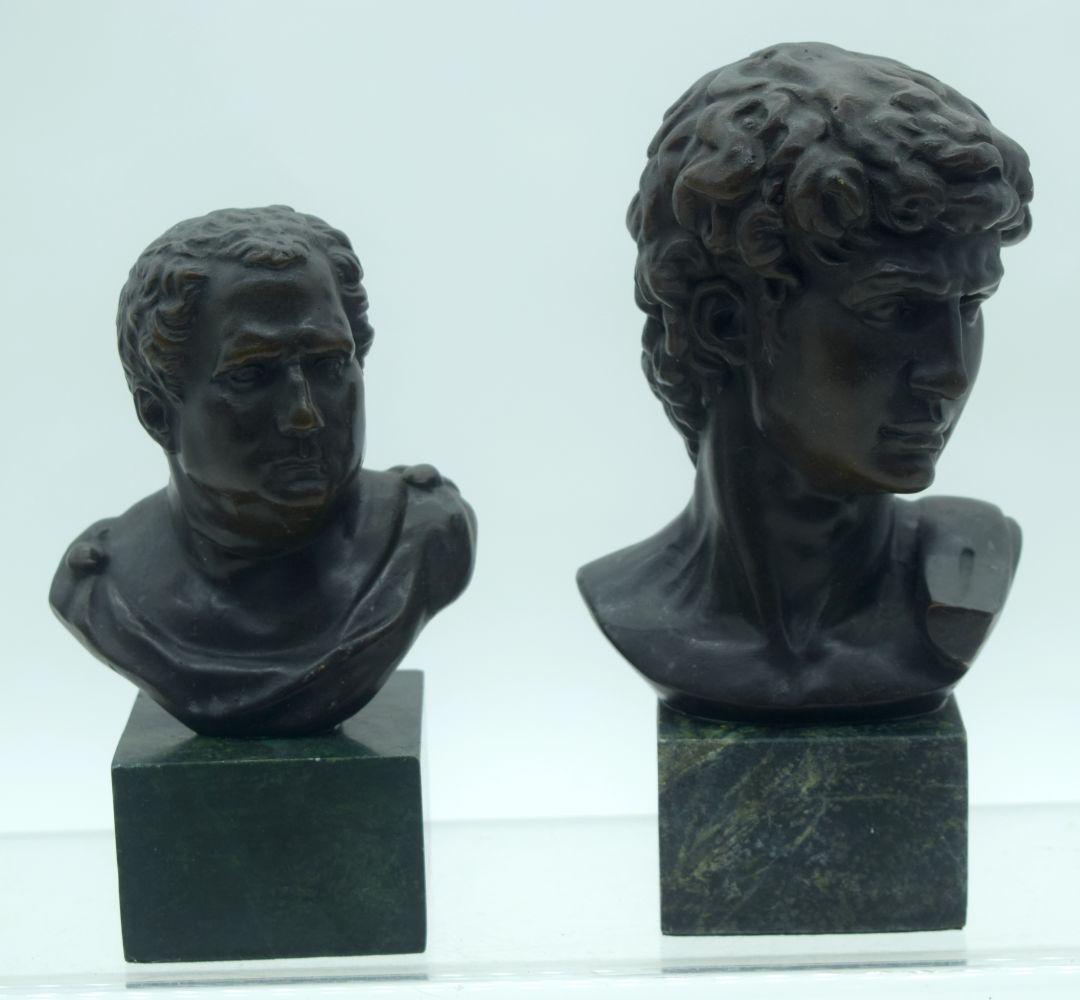 A small bronze bust of Caesar on a plinth together with (1 of 4)