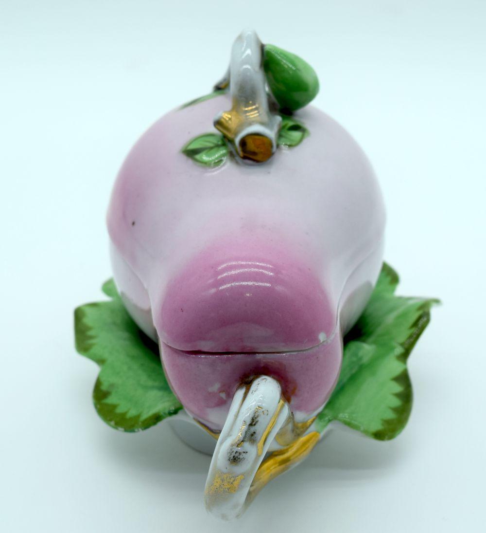 AN UNUSUAL RUSSIAN PORCELAIN VEGETABLE TUREEN AND COVER: AN UNUSUAL RUSSIAN PORCELAIN VEGETABLE TUREEN AND COVER of naturalistic form, with gilded handles. 18 cm x 14 cm.