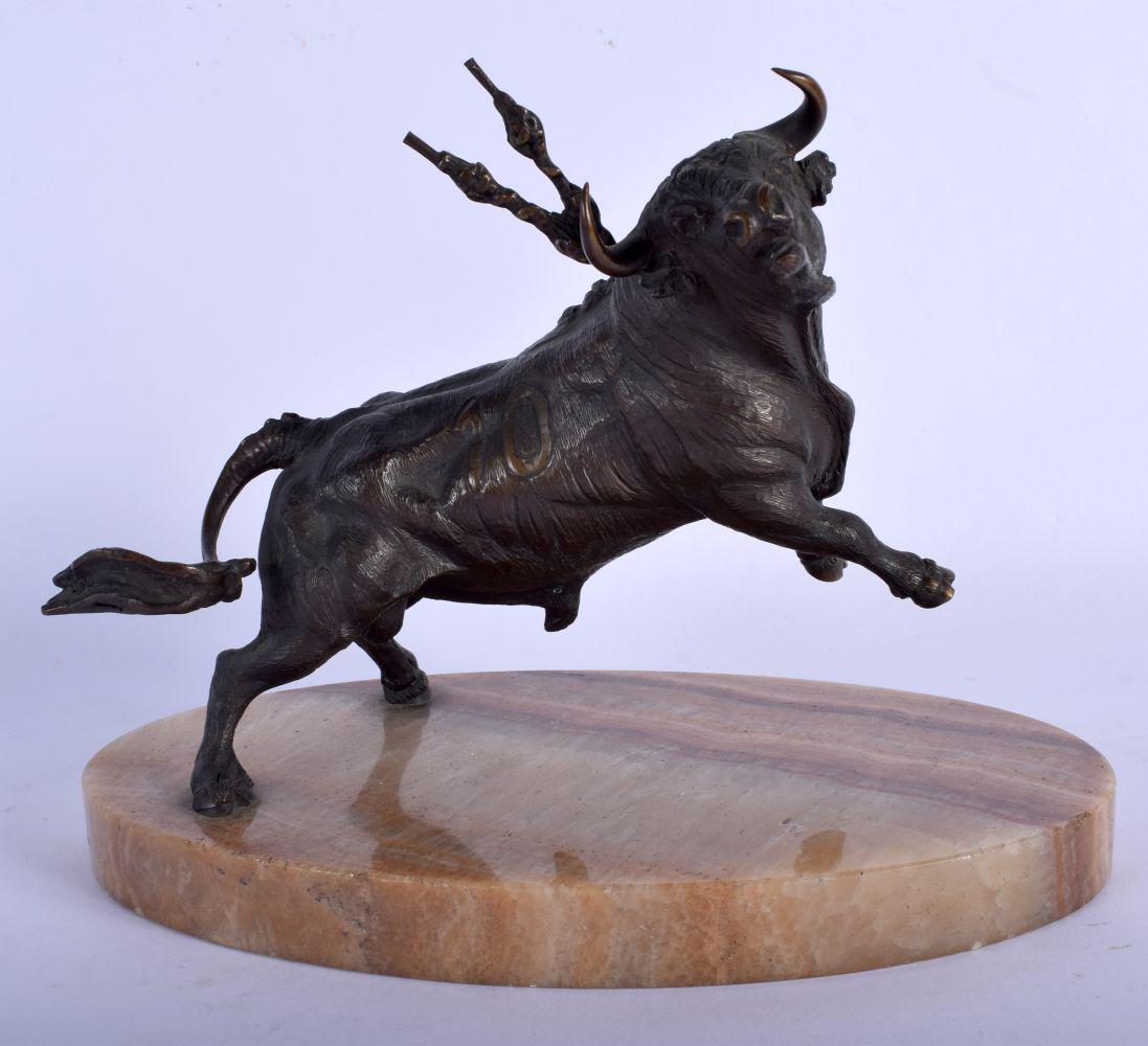 A VERY UNUSUAL EARLY 20TH CENTURY NORTHERN EUROPEAN: A VERY UNUSUAL EARLY 20TH CENTURY NORTHERN EUROPEAN BRONZE FIGURE OF A REARING BULL modelled upon an onyx base. 23 cm x 20 cm.