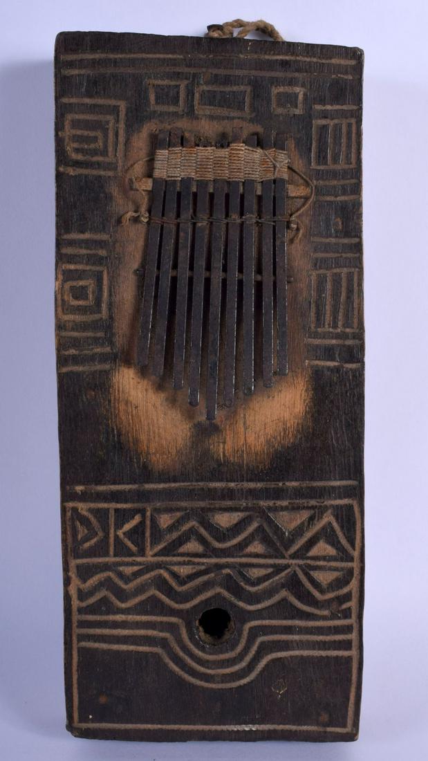 A TRIBAL SOUTH EAST AFRICAN WOOD THUMB PIANO. 24 cm x (1 of 3)