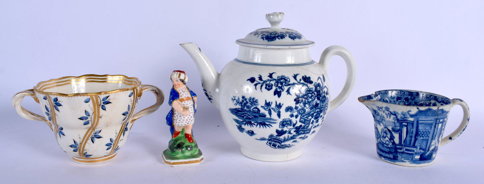 AN 18TH CENTURY CHELSEA DERBY TWIN HANDLED CHOCOLATE: AN 18TH CENTURY CHELSEA DERBY TWIN HANDLED CHOCOLATE CUP together with a Worcester teapot etc. Largest 18 cm wide. (4)