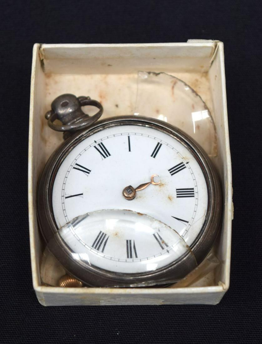 AN ANTIQUE SILVER POCKET WATCH. 5 cm diameter, (1 of 8)