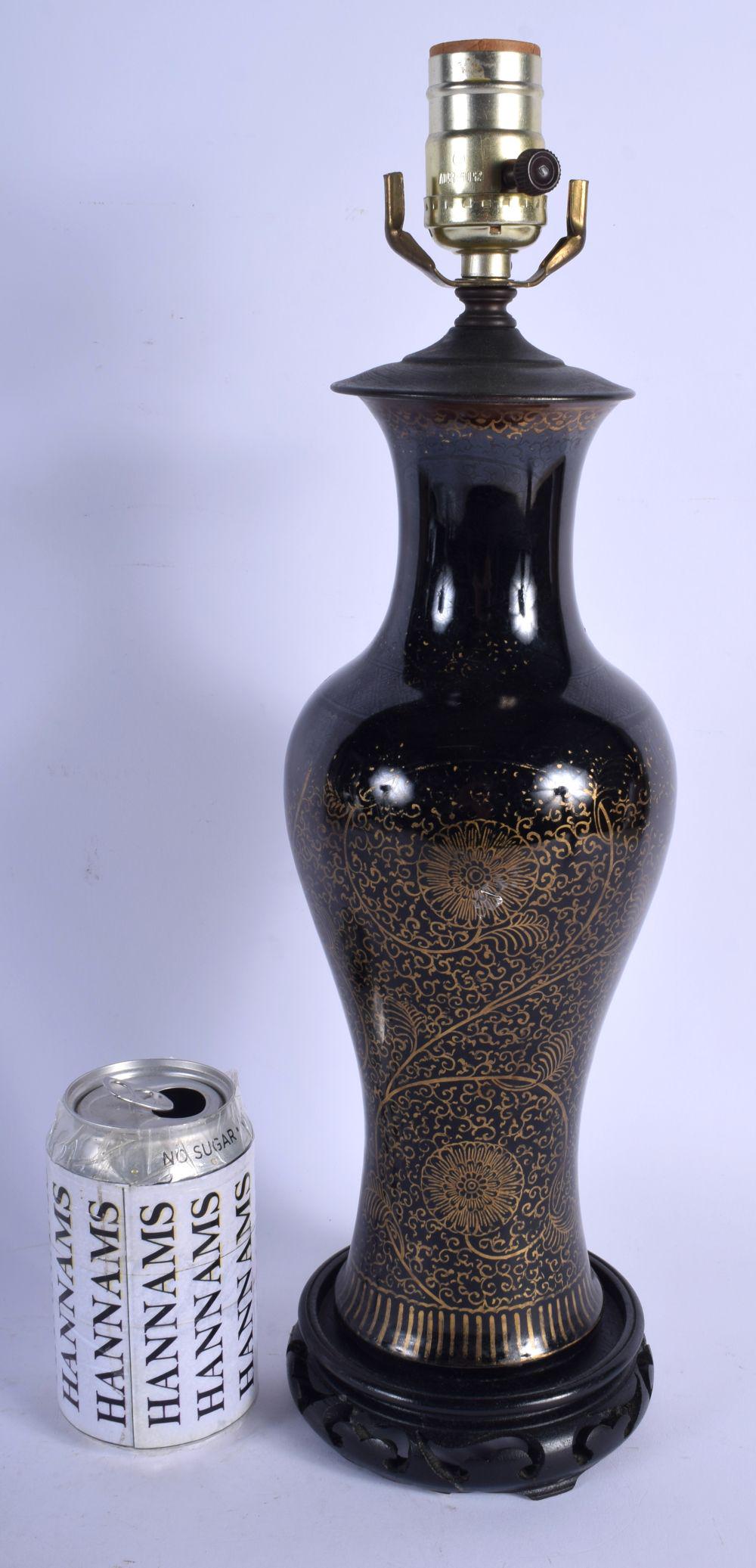 A 19TH CENTURY CHINESE BLACK GLAZED PORCELAIN VASE (1 of 2)